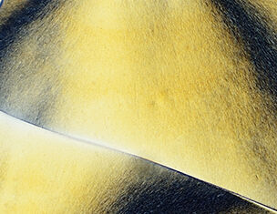 Abstract close-up of textured surfaces in shades of yellow and black, creating a dynamic interplay of light and shadow.