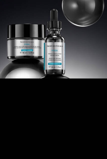 Serum SkinCeuticals CE Ferulic, creme A.G.E. Advanced Interrupter et serum HA Intensifier Multi-Glycan dans une boite avec des rubans de la marque sur fond sombre.