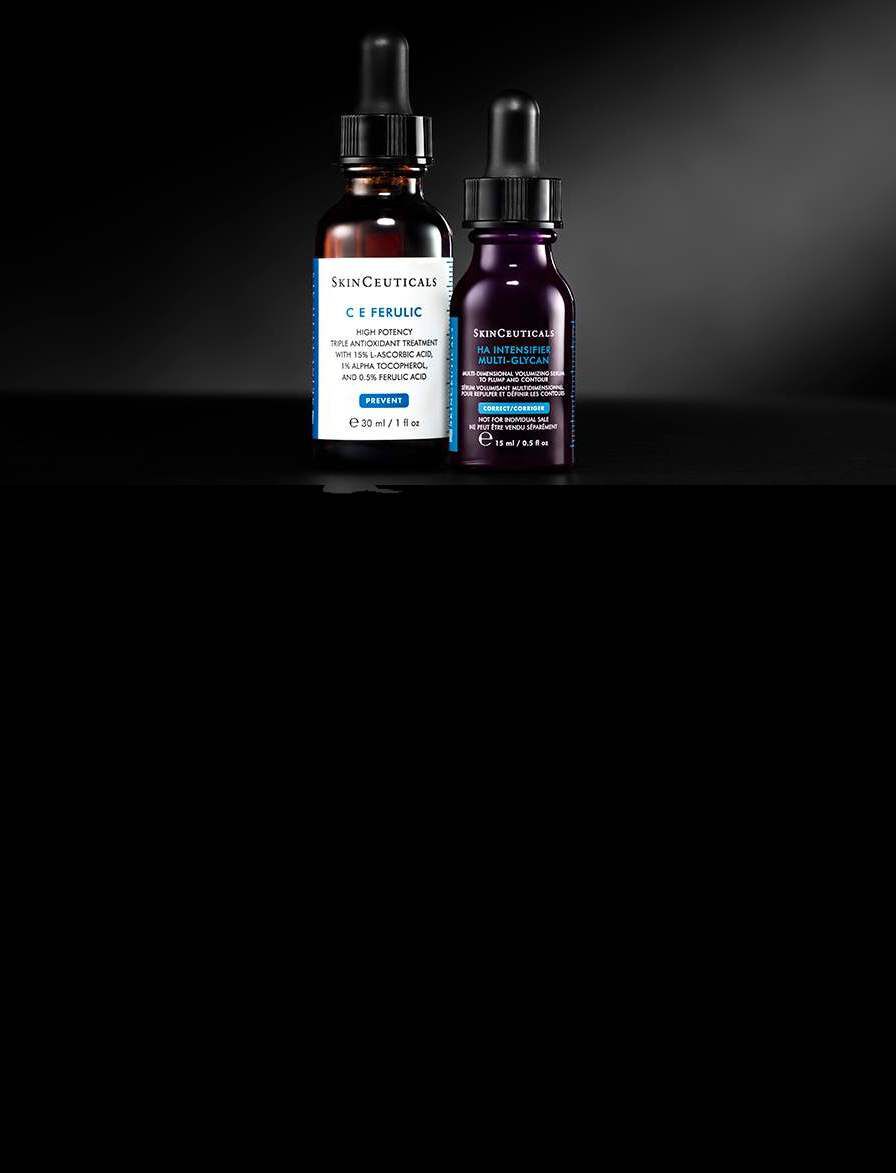 Deux flacons de serum sur un fond noir, l'un avec une etiquette blanche et l'autre avec une etiquette foncee.